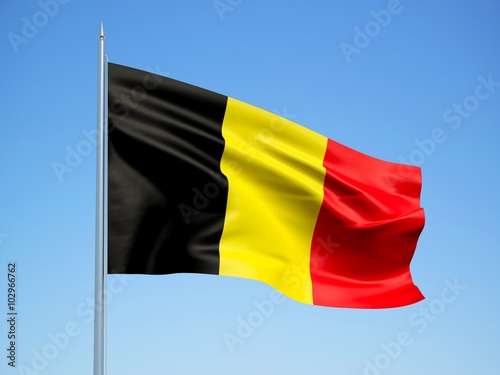 Belgium 3d flag floating in the wind with a blue sky background 