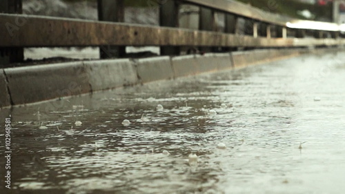 Wallpaper Mural Pouring rain in winter. Water flows along the street. Torontodigital.ca