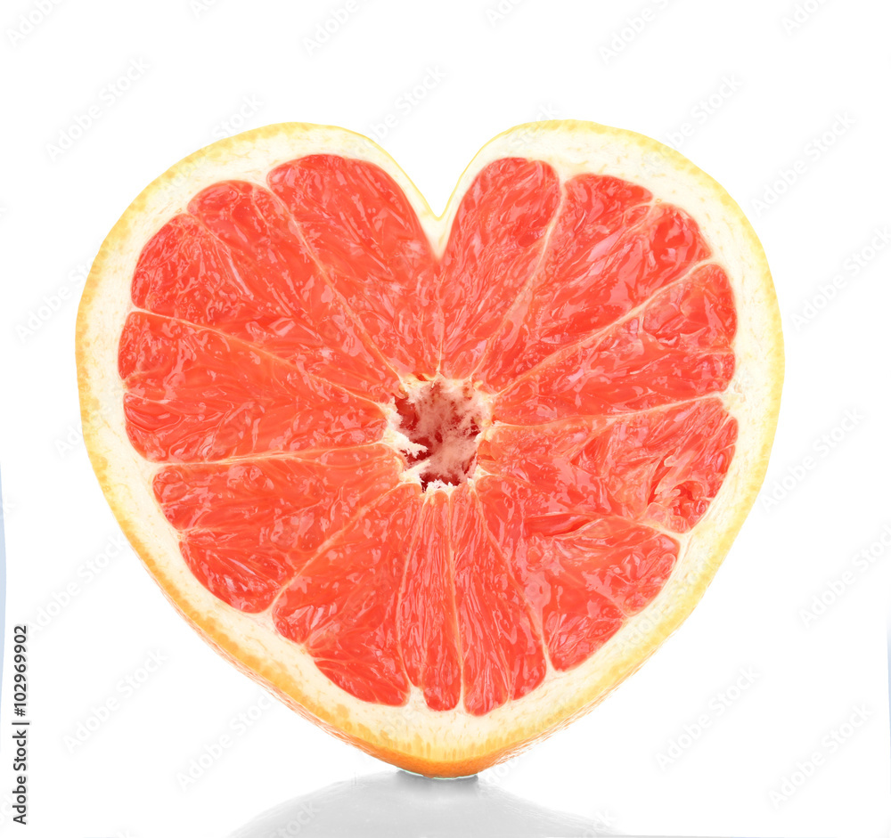 Half of ripe grapefruit in heart shape isolated on white Half of ripe grapefruit in heart shape isolated on white