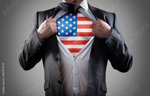 Foto Businessman superhero with the American flag shirt