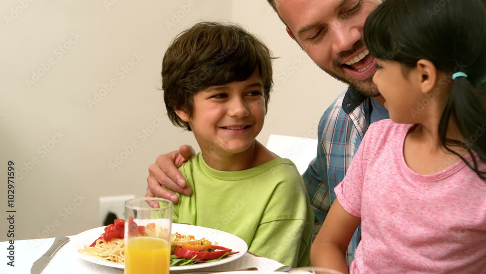 Happy father and kids having lunch Happy father and kids having lunch