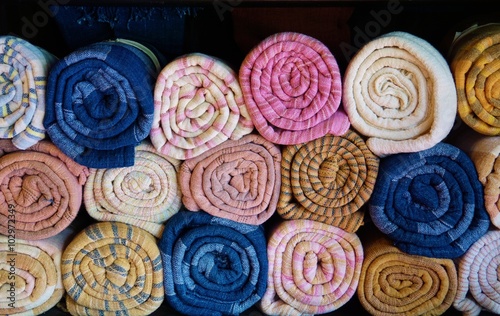 Colorful rolled silk scarves in Laos