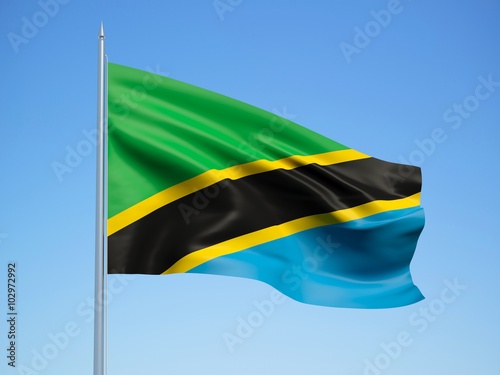 Tanzania 3d flag floating in the wind with a blue sky background