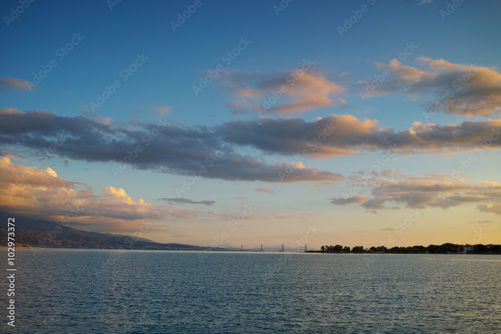 Sunset over The cable bridge between Rio and Antirrio view from Nafpactos, Patra, Western Greece Sunset over The cable bridge between Rio and Antirrio view from Nafpactos, Patra, Western Greece