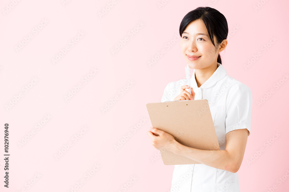 portrait of asian nurse isolated on pink background portrait of asian nurse isolated on pink background