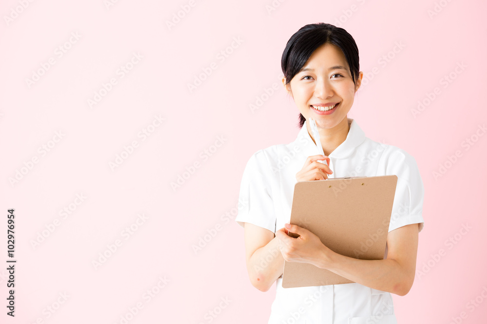 portrait of asian nurse isolated on pink background portrait of asian nurse isolated on pink background