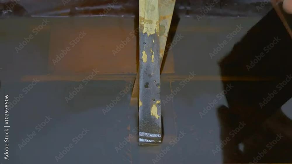 Man's Hands in Protective Gloves Making The Etching of a Copper Plate in Acid in Container Man Took Out the Plates Engraved Pictures on a Copper