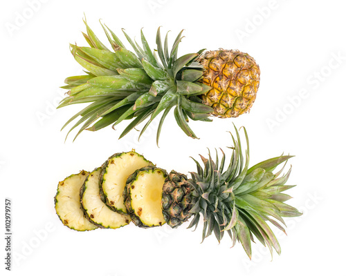 Pineapple with slices on white background.