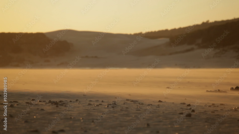 Sand floating on the beach carry away by the wind Sand floating on the beach carry away by the wind