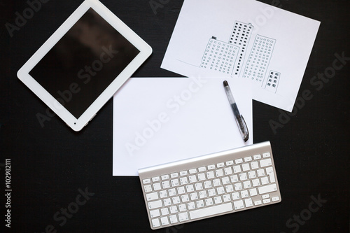 painted city, business concept, tablet, keyboard, white sheet  t