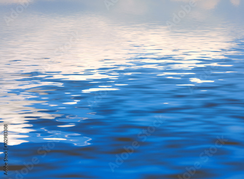 Abstract series of waves on the water surface