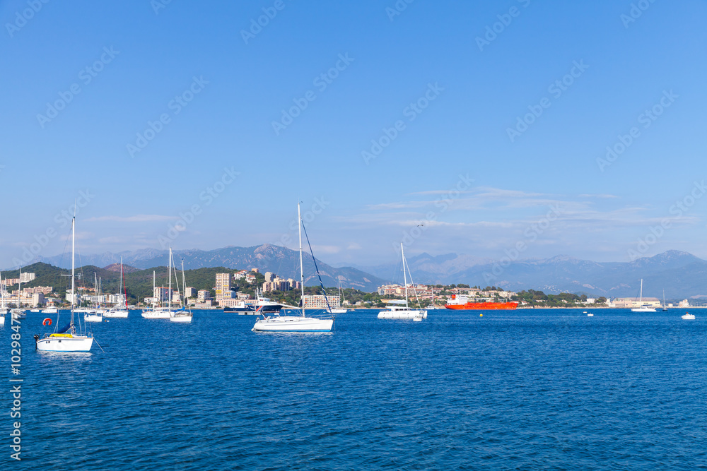 Sailing yachts and motor boats moored in bay of Ajaccio