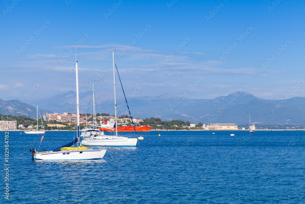 Sailing yachts and motorboats moored in bay of Ajaccio