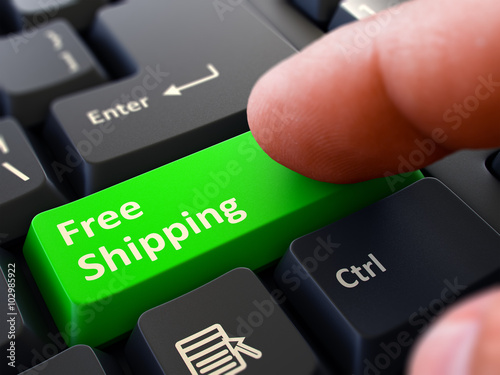 Computer User Presses Green Button Free Shipping on Black Keyboard. Closeup View. Blurred Background. 3D Render.