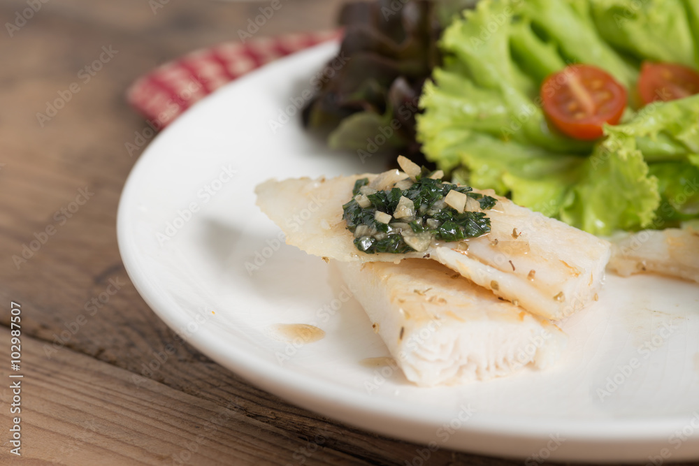 Clean food, Fish fillet with basil and garlic sauce. Clean food, Fish fillet with basil and garlic sauce.