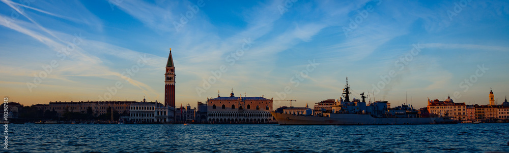 Venice sunset landscape Venice Sunset with Calm Lake with reflection of the surrounding area blue and clouds in the sky that glows orange