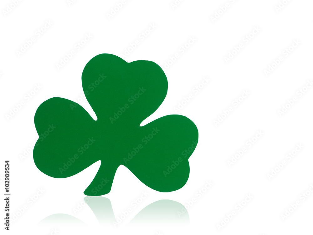 Photograph of a green shamrock shape isolated on white with a reflection below. Photograph of a green shamrock shape isolated on white with a reflection below.