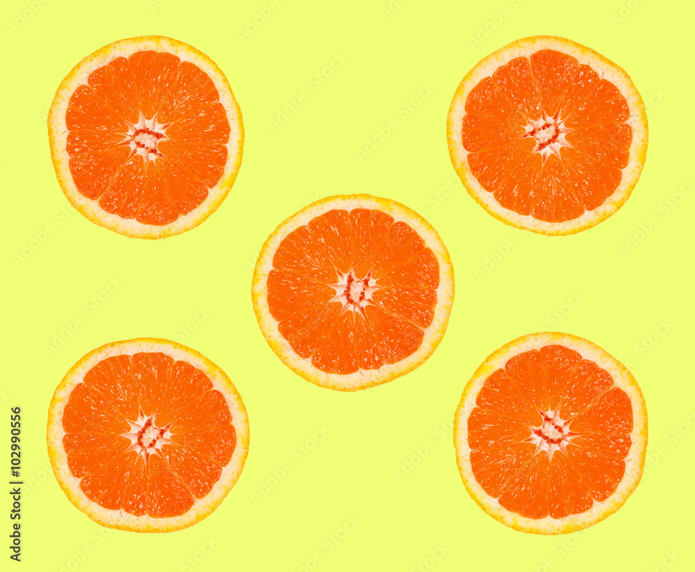 slices of grapefruit on a yellow background slices of grapefruit on a yellow background