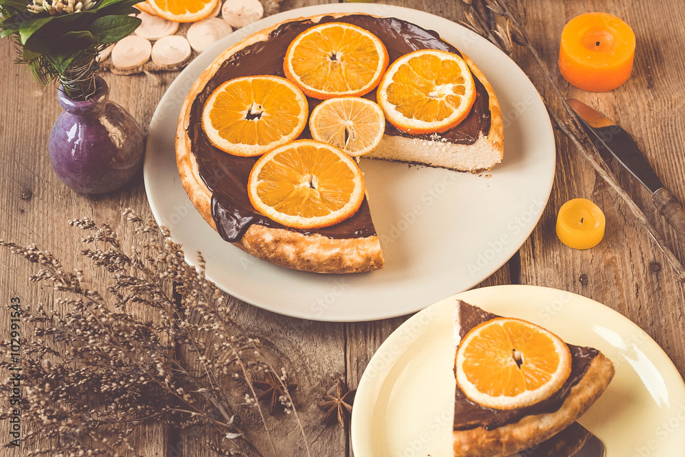 Orange cake on the wooden background