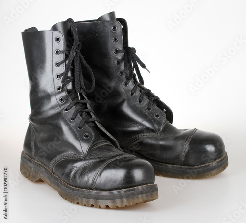 Obraz na plátne Old black leather boots