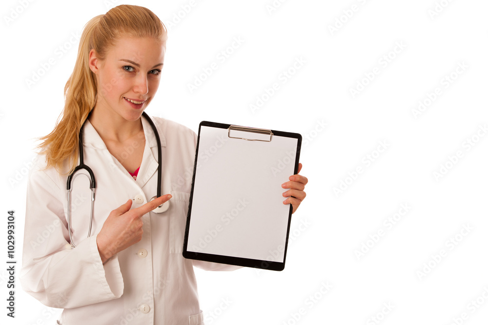 Woman doctor with stethoscope around neck showing clipboard with Woman doctor with stethoscope around neck showing clipboard with