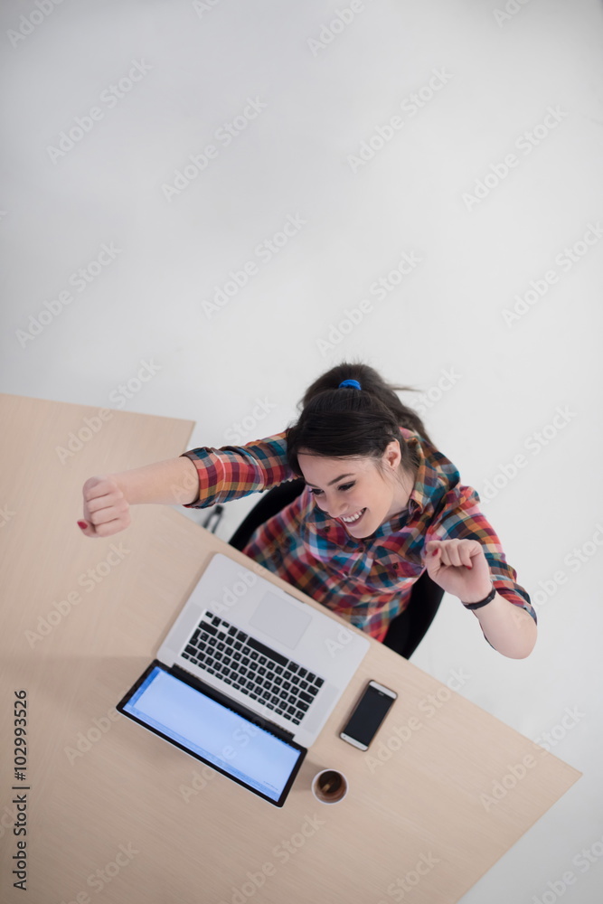 top view of young business woman working on laptop