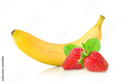 Ripe fresh banana and juicy strawberry with green leaf