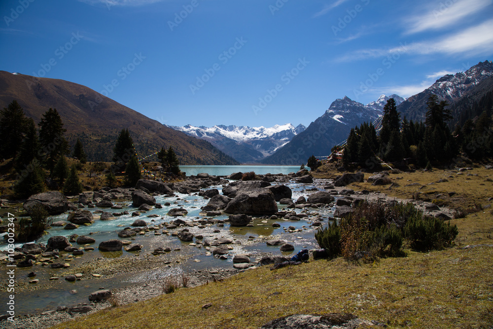 Turquoise Xinluhai lake in Kham region of Tibet, Sichuan, China