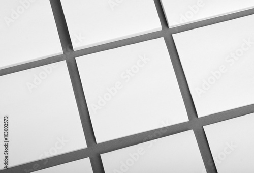 Collection of white note papers on gray background.