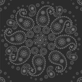 Black background with a paisley ornament. Circular ornament. Vector pattern