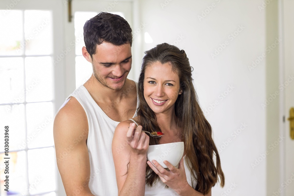 Young couple having breakfast in kitchen Young couple having breakfast in kitchen