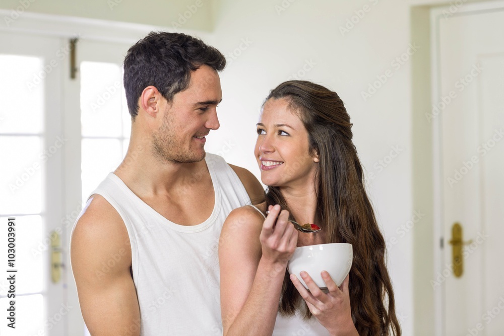 Young couple having breakfast in kitchen Young couple having breakfast in kitchen