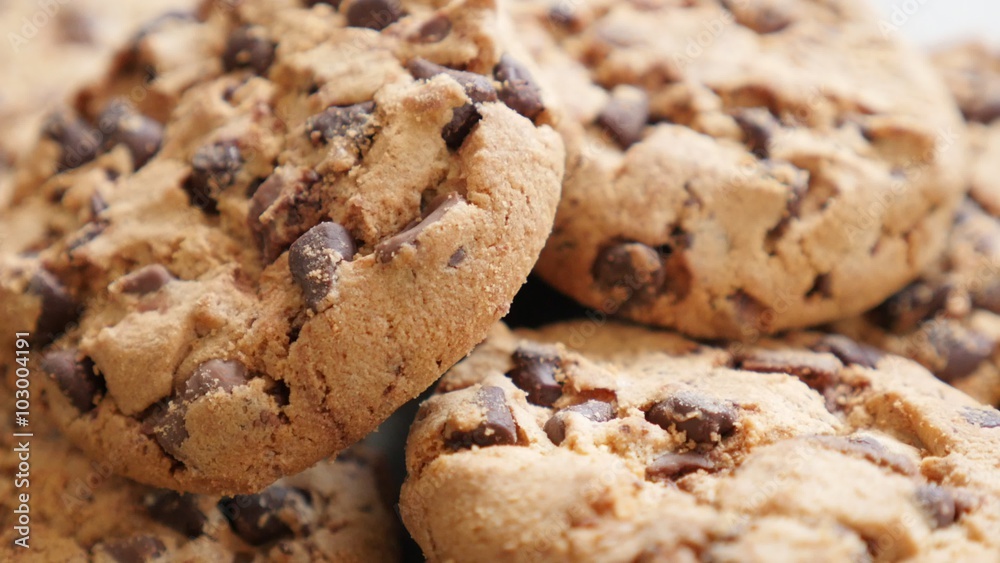 Cookies fresh made of chocolate and flour arranged on table slow tilting 4K 2160p UltraHD footage - Chocolate biscuit cookies on wooden surface 4K 3840X2160 UHD tilting video Cookies fresh made of chocolate and flour arranged on table slow tilting 4K 2160p UltraHD footage - Chocolate biscuit cookies on wooden surface 4K 3840X2160 UHD tilting video