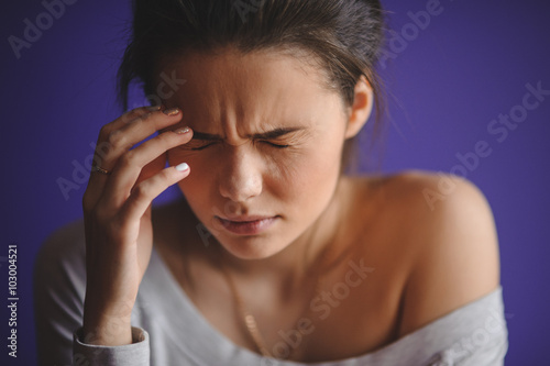 Close up Portrait of woman with headache