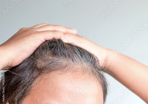 blurred of going gray in young woman shows her gray hair, hair g