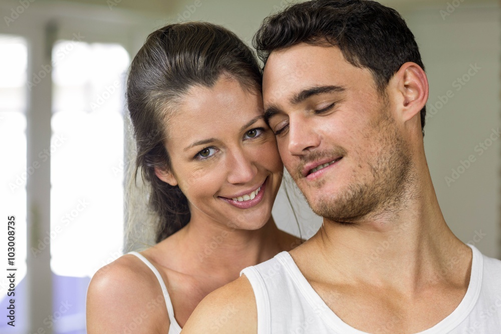 Fototapeta premium Happy couple smiling at the camera