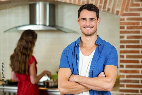 Portrait of young man smiling in kitchen