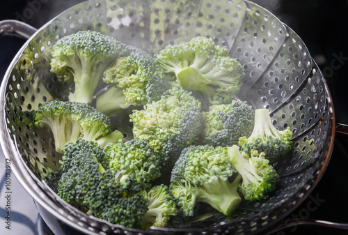 Freshly steamed green broccoli in skimmer pot