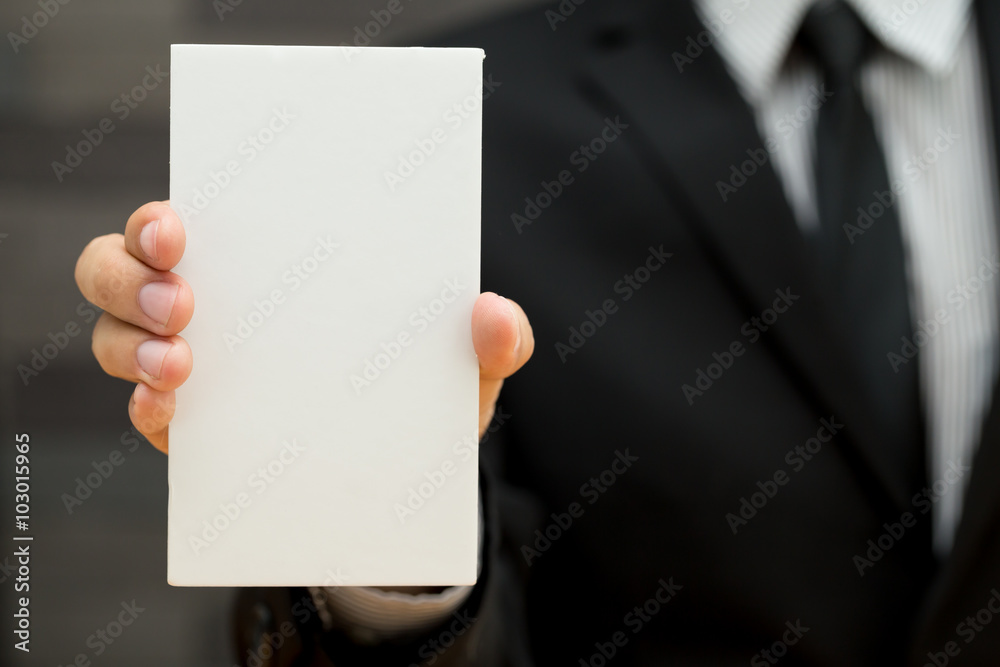 Businessman showing blank signboard Businessman showing blank signboard