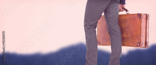 Composite image of low section of man with briefcase