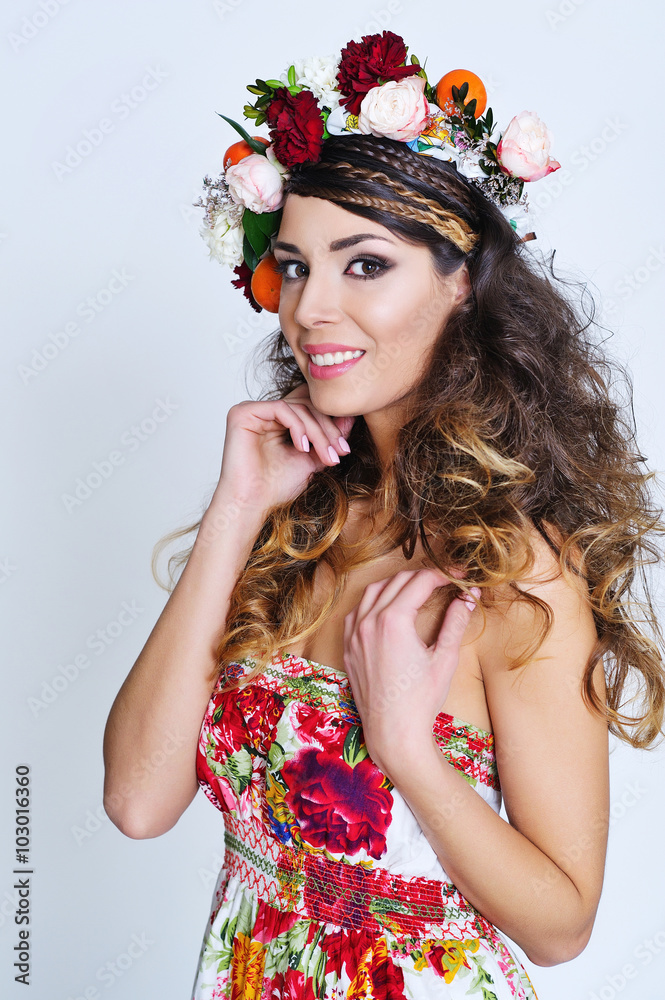 Beauty portrait of a gorgeous woman with gypsy hairstyle wearing flower  crown and fancy dress with floral print Stock Photo | Adobe Stock