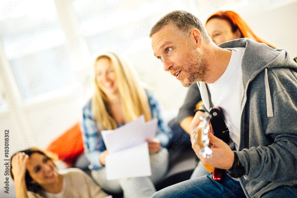Fototapeta premium Home band learning new song together