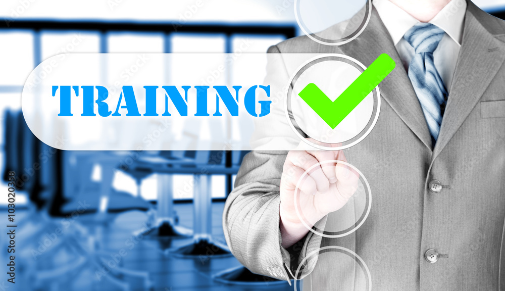 Businessman pressing touch screen interface training checkbox Businessman pressing touch screen interface training checkbox