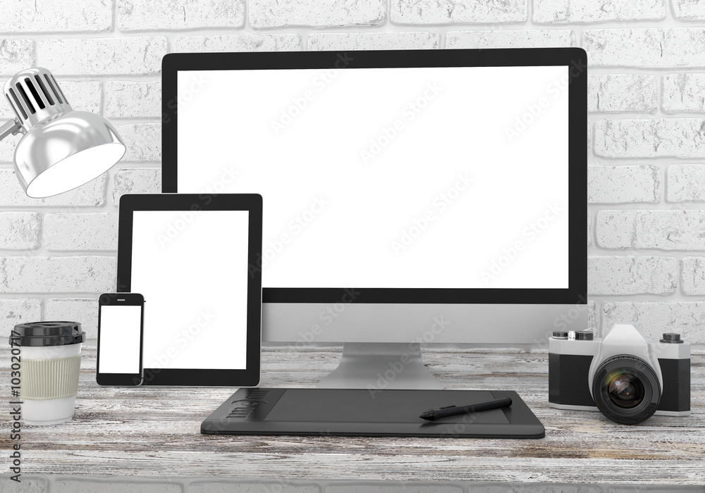 Fototapeta premium Responsive mockup screen. Monitor, tablet, phone on table in office.