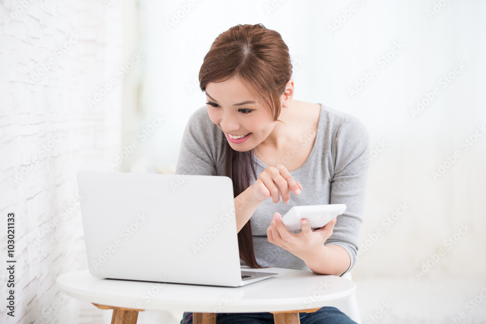 woman with calculator and laptop woman with calculator and laptop