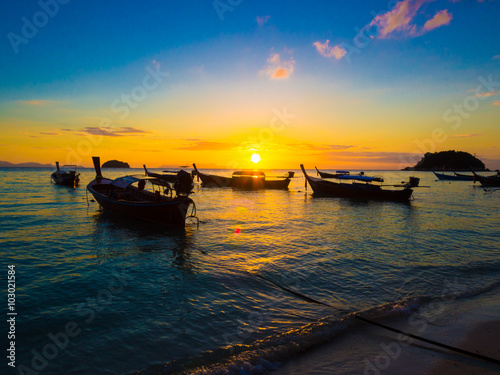 Boat on sea beach sunset