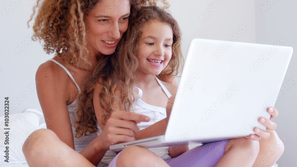 Happy mother and daughter using laptop Happy mother and daughter using laptop