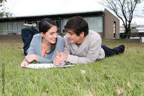 Couple lying on the grass © implementarfilms