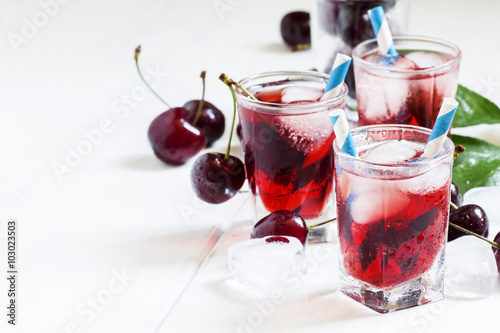 Wallpaper Mural Cold cherry juice with ice on a white wooden background, selecti Torontodigital.ca