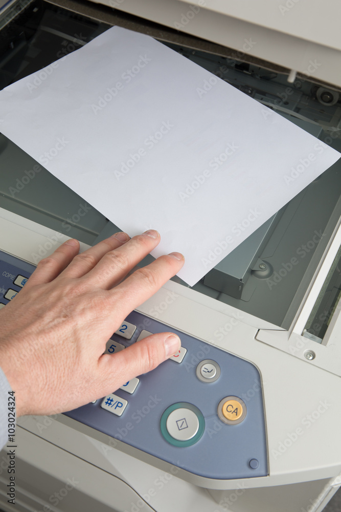 Businessman working with a printer in the office Businessman working with a printer in the office